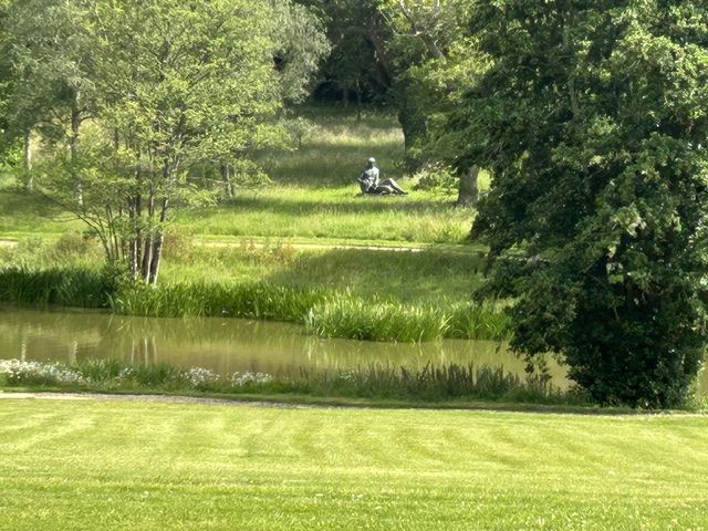 A Sculpture on the far side of one of the two lakes